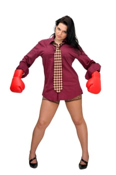 Sexy businesswoman with boxing gloves isolated in white