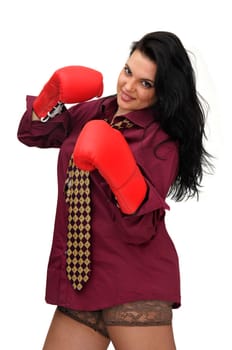 Sexy businesswoman with boxing gloves isolated in white