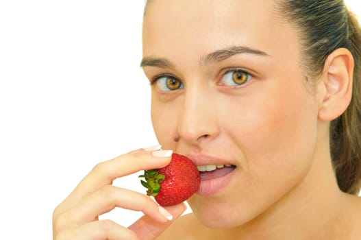 Sexy young girl eating a strawberry isolated in white