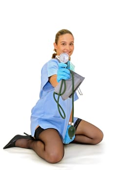 Sexy young doctor with blood pressure device posing against a white background