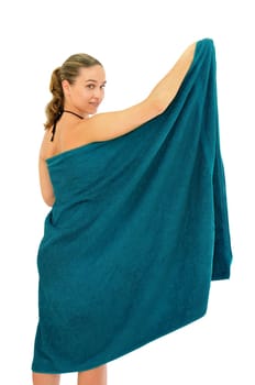 Sexy young girl with a colorful towel posing isolated in white