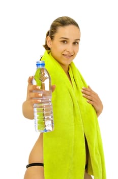 Sexy young girl with towel and water bottle isolated in white