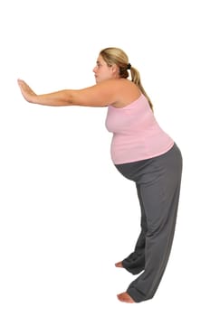 Pregnant woman making exercises isolated in white