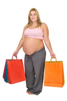 Pregnant woman with shopping bags isolated in white