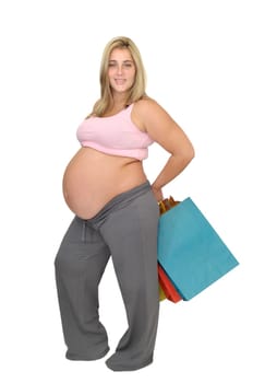 Pregnant woman with shopping bags isolated in white