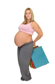 Pregnant woman with shopping bags isolated in white