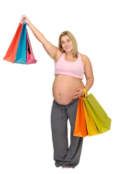 Pregnant woman with shopping bags isolated in white
