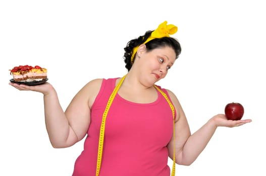 Large girl with a cake in one hand and an apple in the other