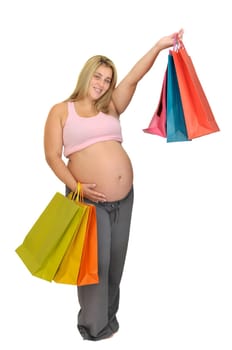 Pregnant woman with shopping bags isolated in white