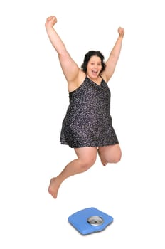 Large girl in nightie jumping over a scale isolated in white