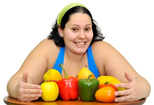 Large girl with fruit and vegetables isolated in white