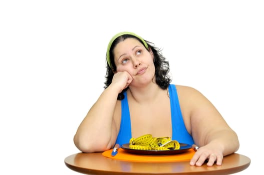 Large girl eating a measuring tape isolated in white