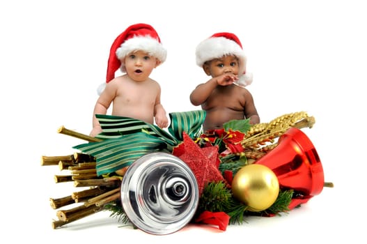 Beautiful babies with Christmas hat isolated in white