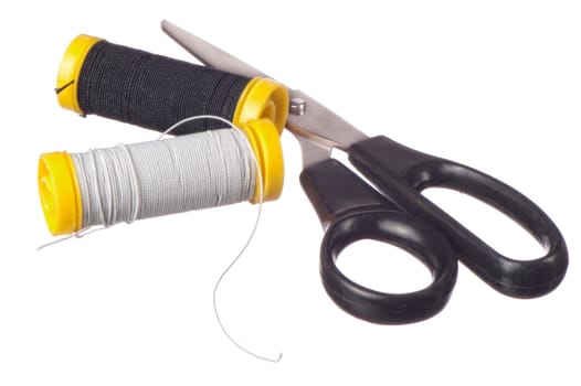 elastic thread and scissors on white background