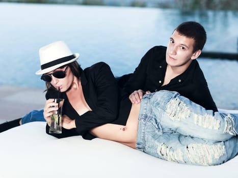 Young couple. Sea on the background