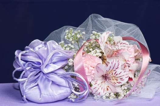 Arrangement with flowers and favors for wedding, baptism and First Communion