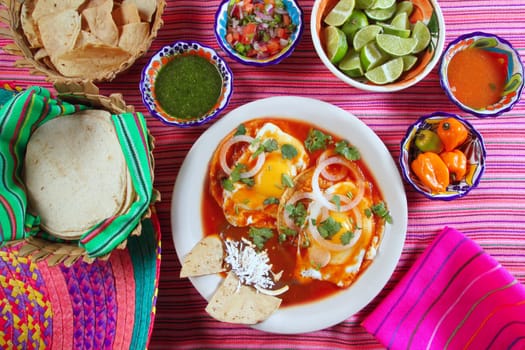 Breakfast Mexican ranchero eggs with chili and nachos Mexico flavor