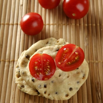 Sesame seeds biscuits over bamboo stripes