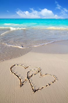 hearts in love written in Caribbean tropical beach sand