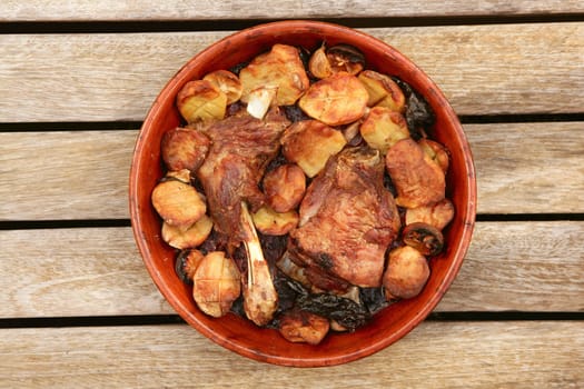 Lamb meat roast oven on clay casserole potatoes on wood Mediterranean food