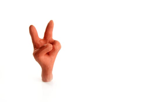 Winner two finger plasticine hand, handmade isolated on white