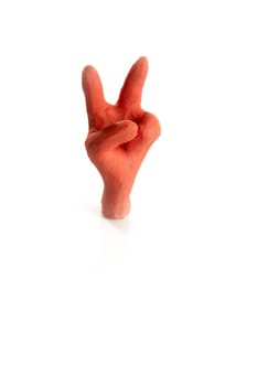 Winner two finger plasticine hand, handmade isolated on white