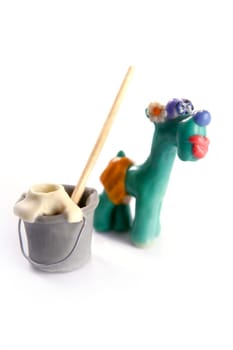 Lazy handmade plasticine housekeeping dog, funny, isolated on white