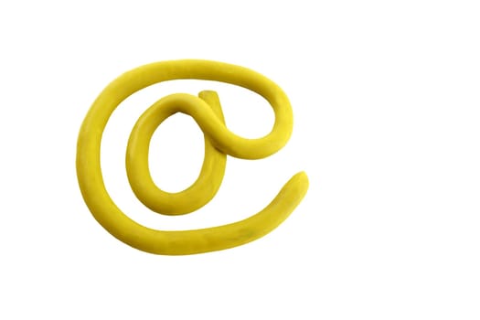 Yellow plasticine arroba email sign, isolated on white bgackground