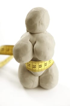 Fat woman handmade plasticine figurine isolated on white