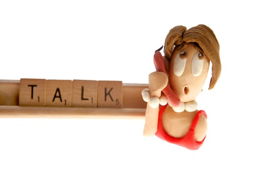 Alphabet game spelling: talk. Plasticine woman talking by phone