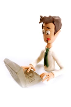 stressed plasticine handmade businessman with laptop isolated on white