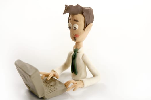 stressed plasticine handmade businessman with laptop isolated on white