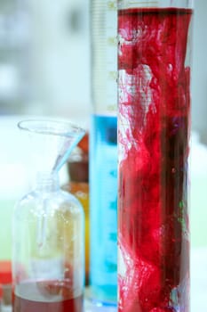 Laboratory stuff, glass cylinder vases, colorful liquids, chemical research