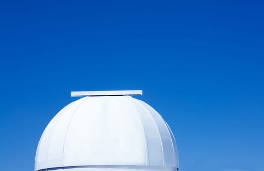astronomical observatory dome in blue sky daylight