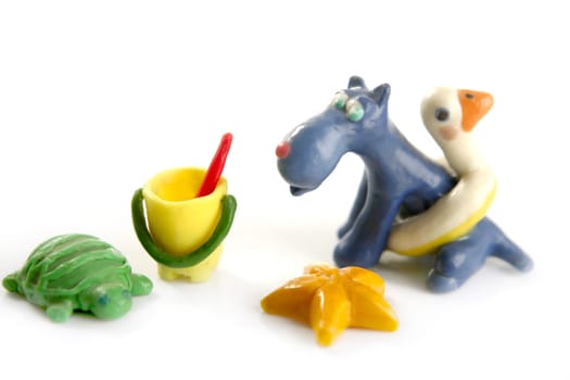 Set of beach toys with dog, plasticine handmade isolated on white