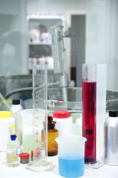 Laboratory stuff, glass cylinder vases, colorful liquids, chemical research