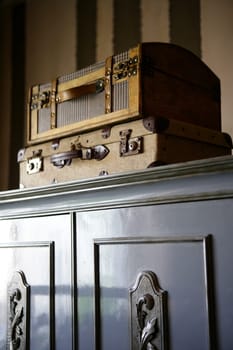 Old suitcases over the wardrobe, vintage style