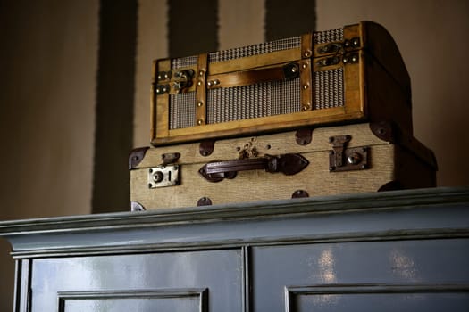 Old suitcases over the wardrobe, vintage style