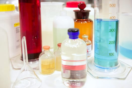 Laboratory stuff, glass cylinder vases, colorful liquids, chemical research