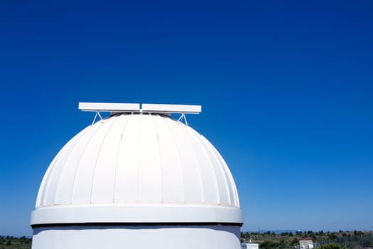 astronomical observatory dome in blue sky daylight