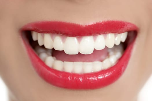 Beautiful woman perfect teeth smile with red lips