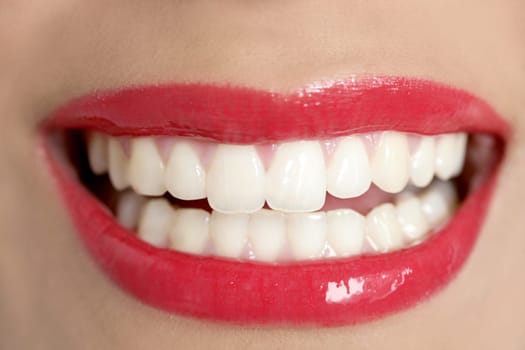 Beautiful woman perfect teeth smile with red lips