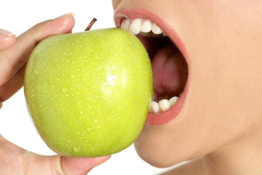 Apple macro on woman mouth detail of bite on white background