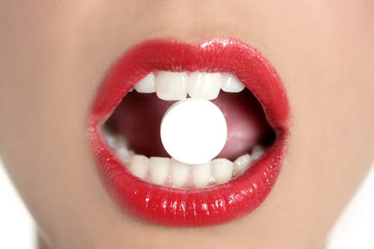 Beauty woman mouth with red lips and medicine pill