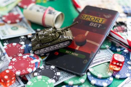 Online poker concept. Smartphone and poker chips on a green background. Poker online banner. Copy space. Vignette. Place for text. Gambling. Background. High quality photo