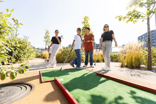 Golf course group of friends people with children posing standing. High quality photo