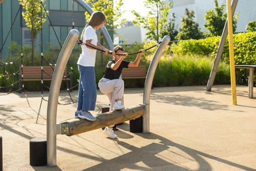 Girl playing on a swing in the park. High quality photo