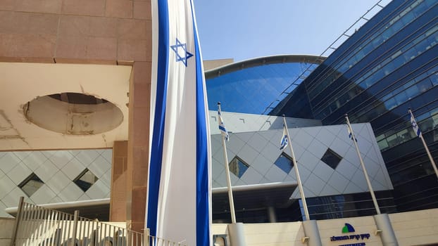 October 23, 2023 Beer Sheva Negev Israel, Ministry of Interior, Israeli flag modern office building, urban architecture. High quality photo