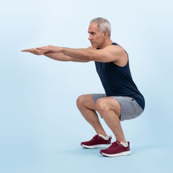 Active and fit physique senior man warming up before exercise on isolated background. Healthy lifelong senior people with fitness healthy and sporty body care lifestyle concept. Clout