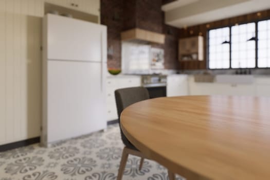 White kitchen with dark red brick, wood, large window and kitchen utensils. L-shaped kitchen with beams and dining table. 3d rendering